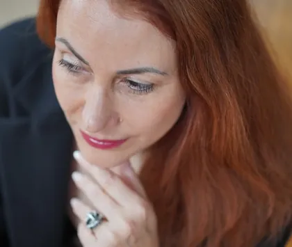 Andrea Kirste, thoughtful, hand on her chin